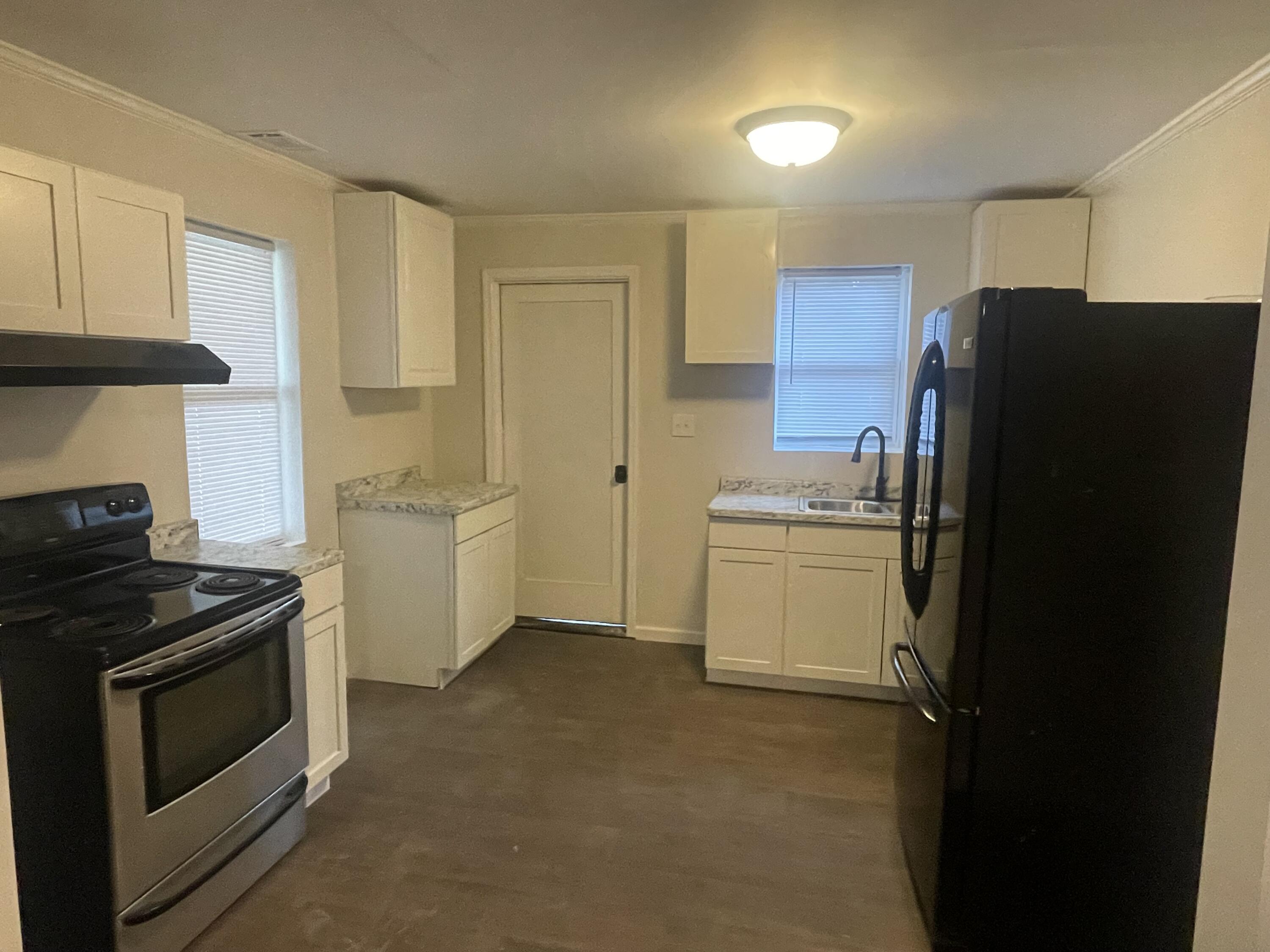 211 3rd Street Thomson, GA 30824 - Photo 5 of 18 Stove and refrigerator to remain