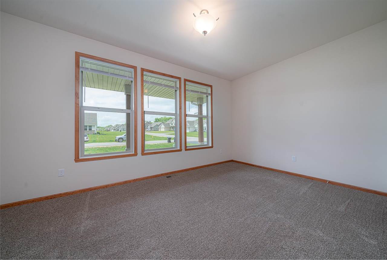 9909 Lismore Road Roscoe, IL 61073 - Photo 16 of 24 an empty room with a window