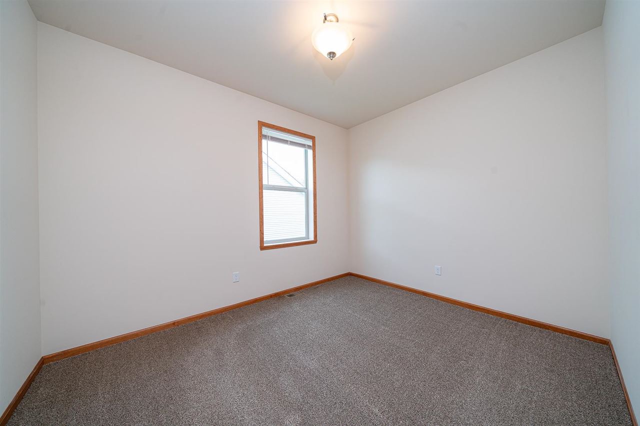 9909 Lismore Road Roscoe, IL 61073 - Photo 17 of 24 an empty room with a window