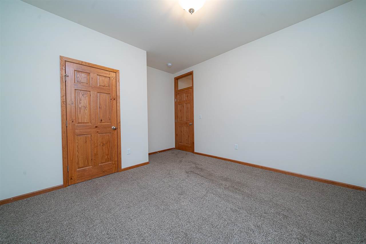 9909 Lismore Road Roscoe, IL 61073 - Photo 18 of 24 an empty room with windows