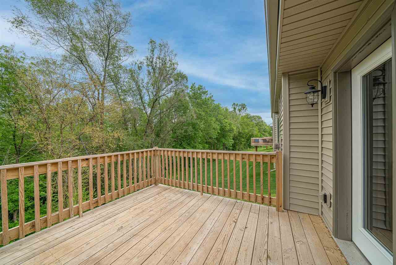 9909 Lismore Road Roscoe, IL 61073 - Photo 23 of 24 a view of balcony with wooden floor