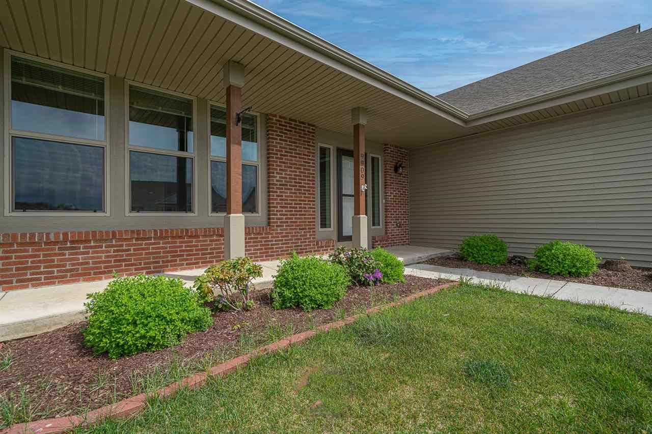 9909 Lismore Road Roscoe, IL 61073 - Photo 3 of 24 front view of a house with a small yard