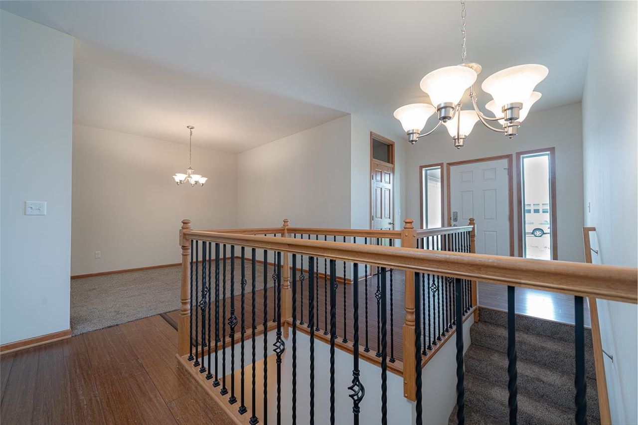 9909 Lismore Road Roscoe, IL 61073 - Photo 5 of 24 a view of a porch with wooden floor