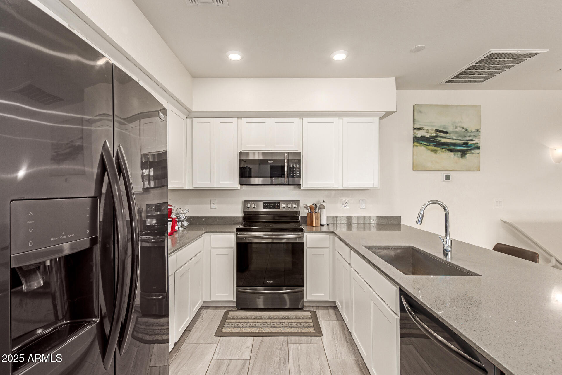 1851 East Frye Road, Unit 101 Gilbert, AZ 85295 - Photo 12 of 37 a kitchen with a sink appliances and cabinets