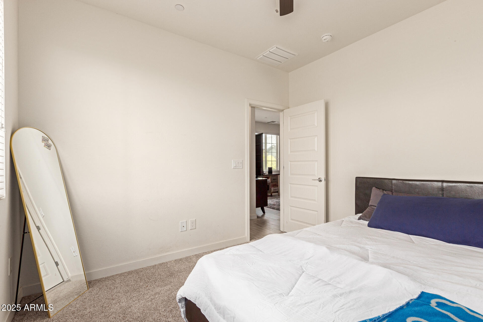 1851 East Frye Road, Unit 101 Gilbert, AZ 85295 - Photo 19 of 37 a bedroom with a bed and a flat screen tv