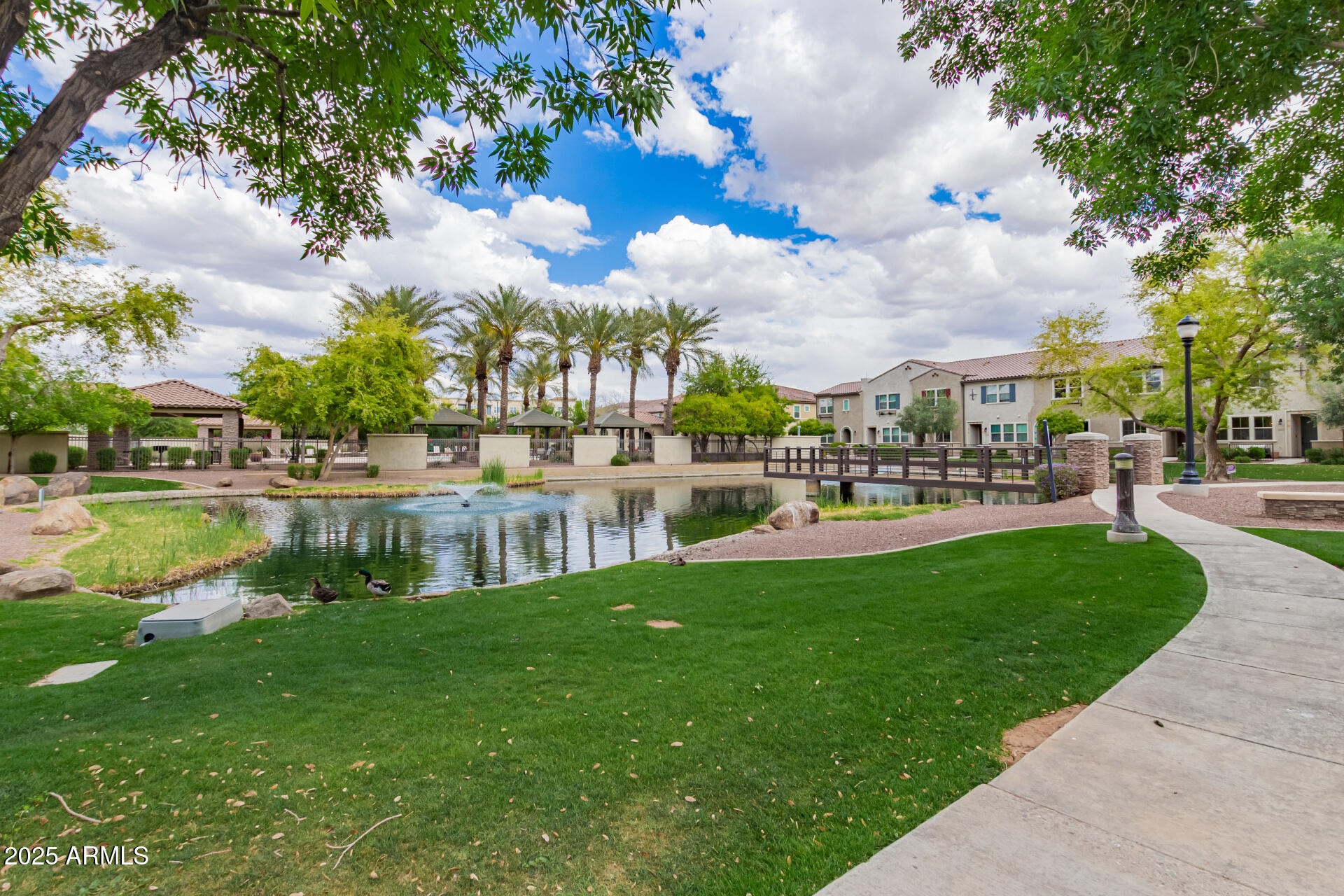 1851 East Frye Road, Unit 101 Gilbert, AZ 85295 - Photo 29 of 37 a view of a lake with houses