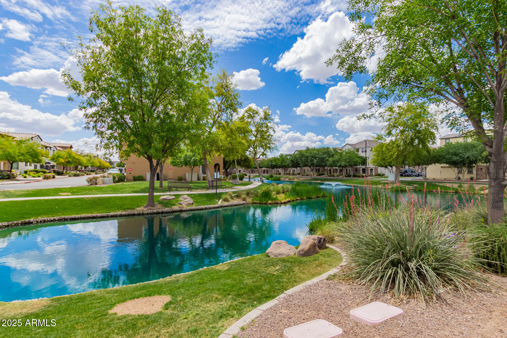 1851 East Frye Road, Unit 101 Gilbert, AZ 85295 - Photo 37 of 37 a view of a lake with a house in the background