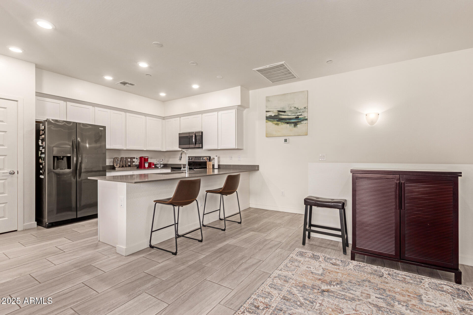 1851 East Frye Road, Unit 101 Gilbert, AZ 85295 - Photo 6 of 37 a kitchen with cabinets and stainless steel appliances