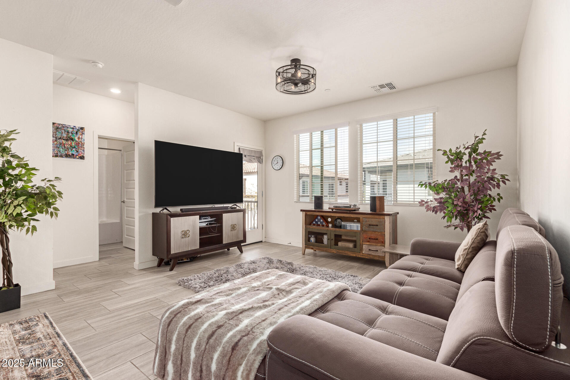 1851 East Frye Road, Unit 101 Gilbert, AZ 85295 - Photo 8 of 37 a living room with furniture and a flat screen tv
