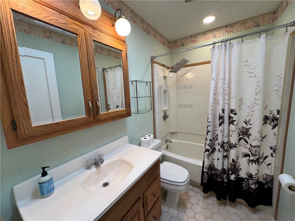 203 Carson Street Springdale, PA 15144 - Photo 15 of 43 a bathroom with a sink toilet and shower