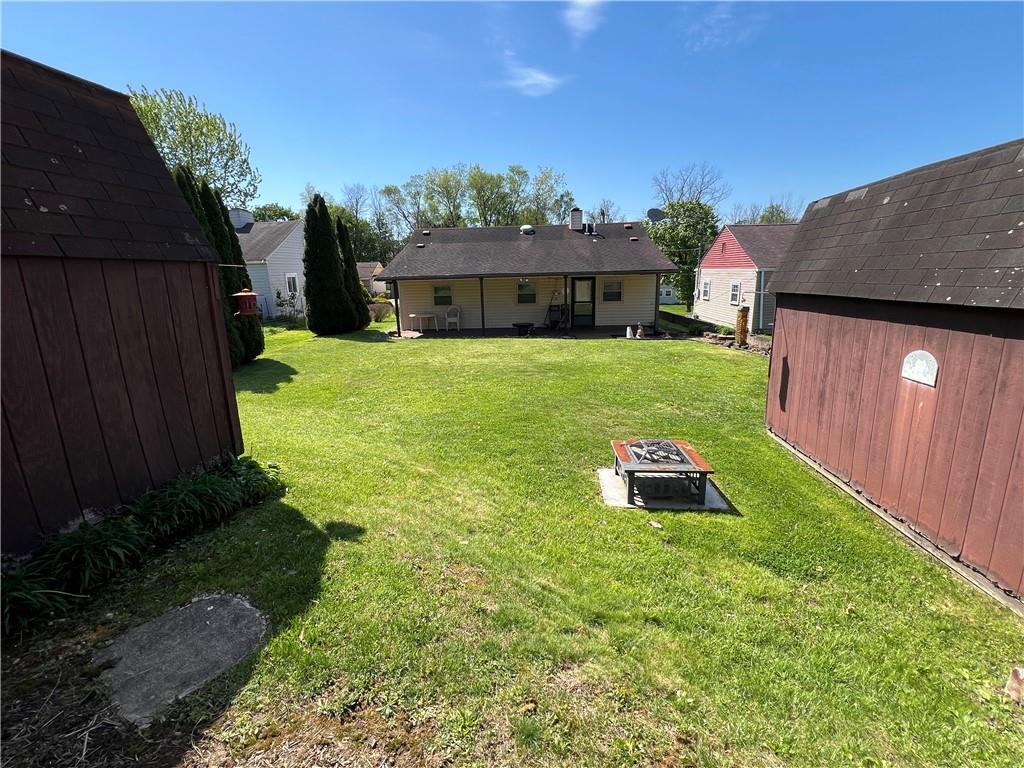 203 Carson Street Springdale, PA 15144 - Photo 29 of 43 a front view of a house with a garden