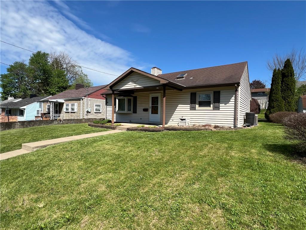 203 Carson Street Springdale, PA 15144 - Photo 31 of 43 a front view of a house with garden