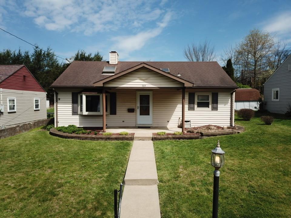 203 Carson Street Springdale, PA 15144 - Photo 34 of 43 a front view of a house with a yard