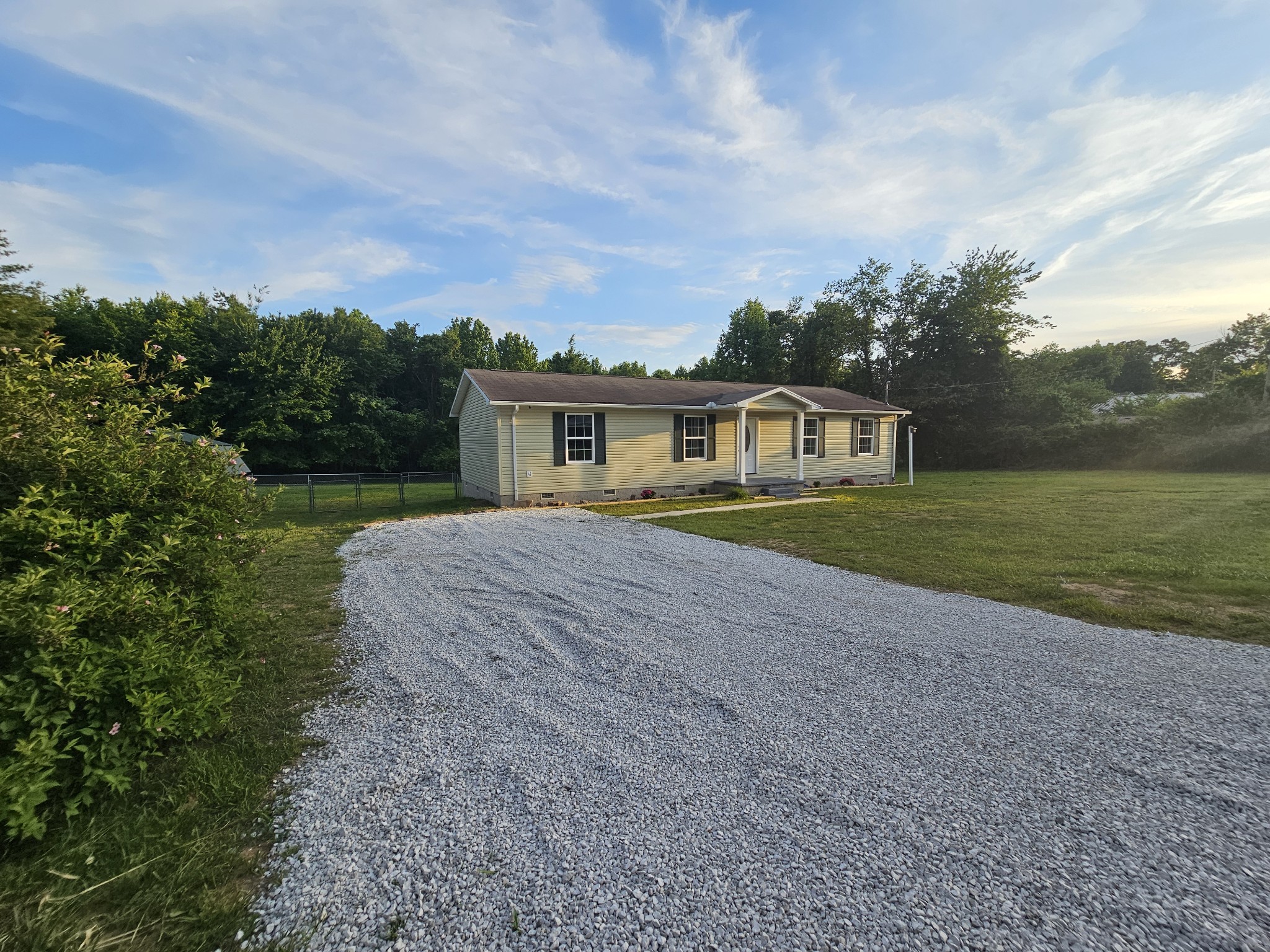 362 Forest Point Road Monteagle, TN 37356 - Photo 9 of 42 a front view of a house with a yard and lake view
