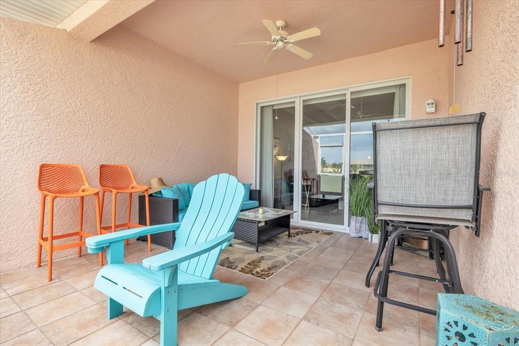 1260 Rio De Janeiro Avenue, Unit 102 Punta Gorda, FL 33983 - Photo 33 of 46 a living room with furniture a dining table and a fireplace