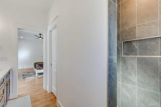 a bathroom with a mirror and a shower