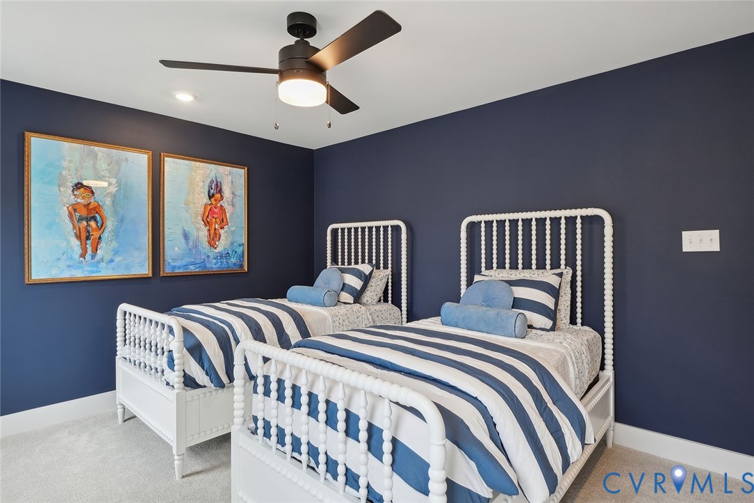 8711 Terroir Lane New Kent, VA 23124 - Photo 17 of 27 a bedroom with two beds and ceiling fan