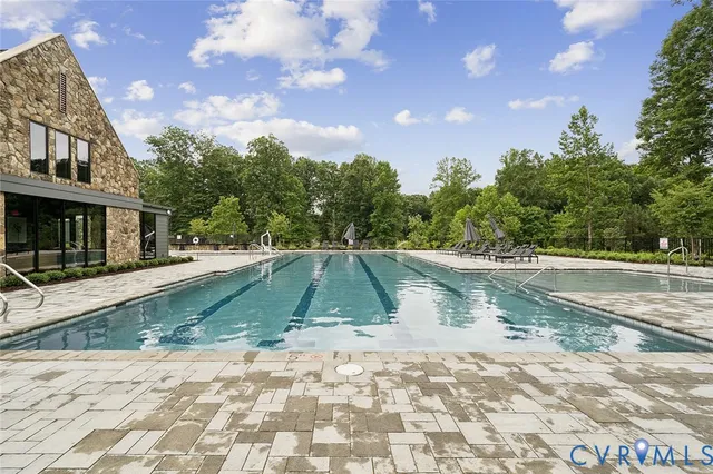 a view of a swimming pool with a yard