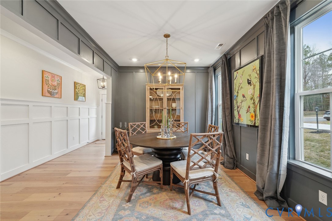 8711 Terroir Lane New Kent, VA 23124 - Photo 4 of 27 a view of a dining room with furniture window and outside view