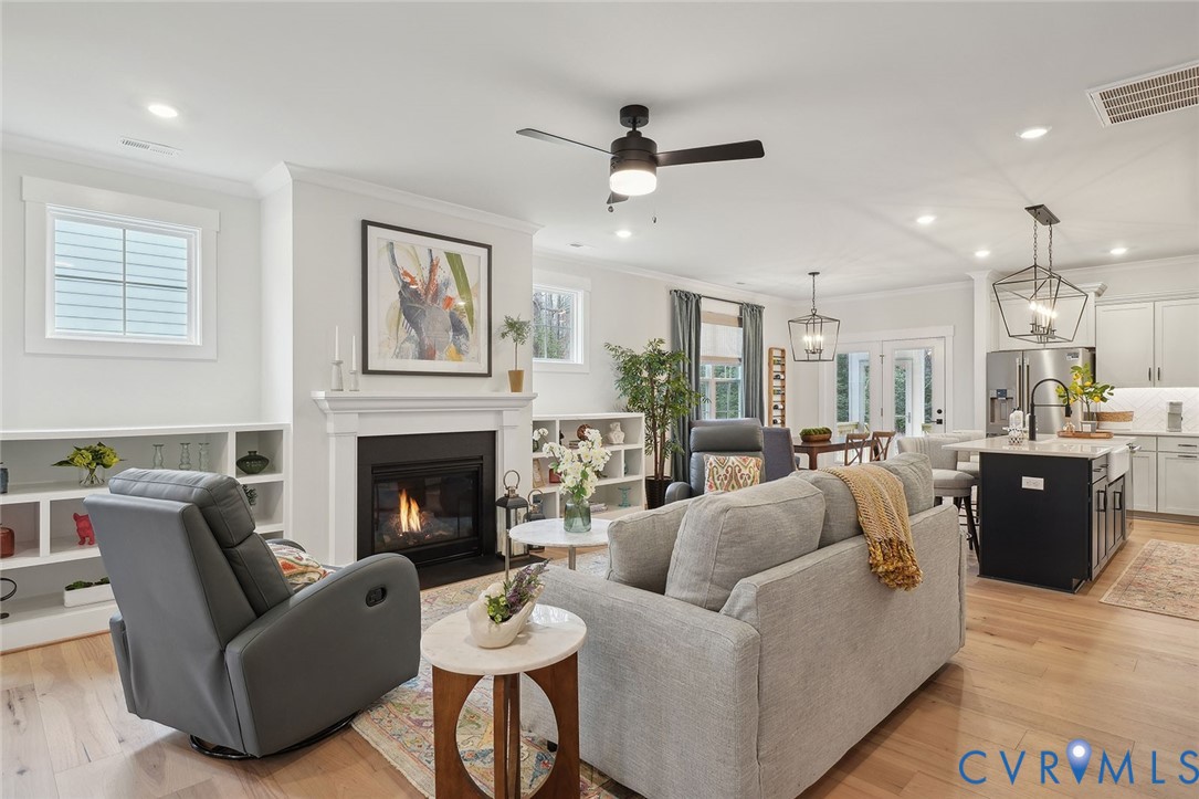 8711 Terroir Lane New Kent, VA 23124 - Photo 5 of 27 a living room with furniture and a fireplace