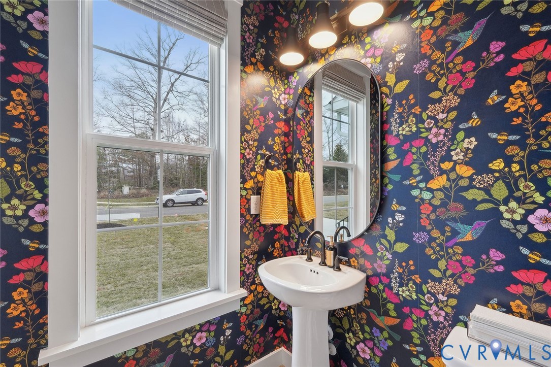 8711 Terroir Lane New Kent, VA 23124 - Photo 9 of 27 a bathroom with a sink mirror and vanity