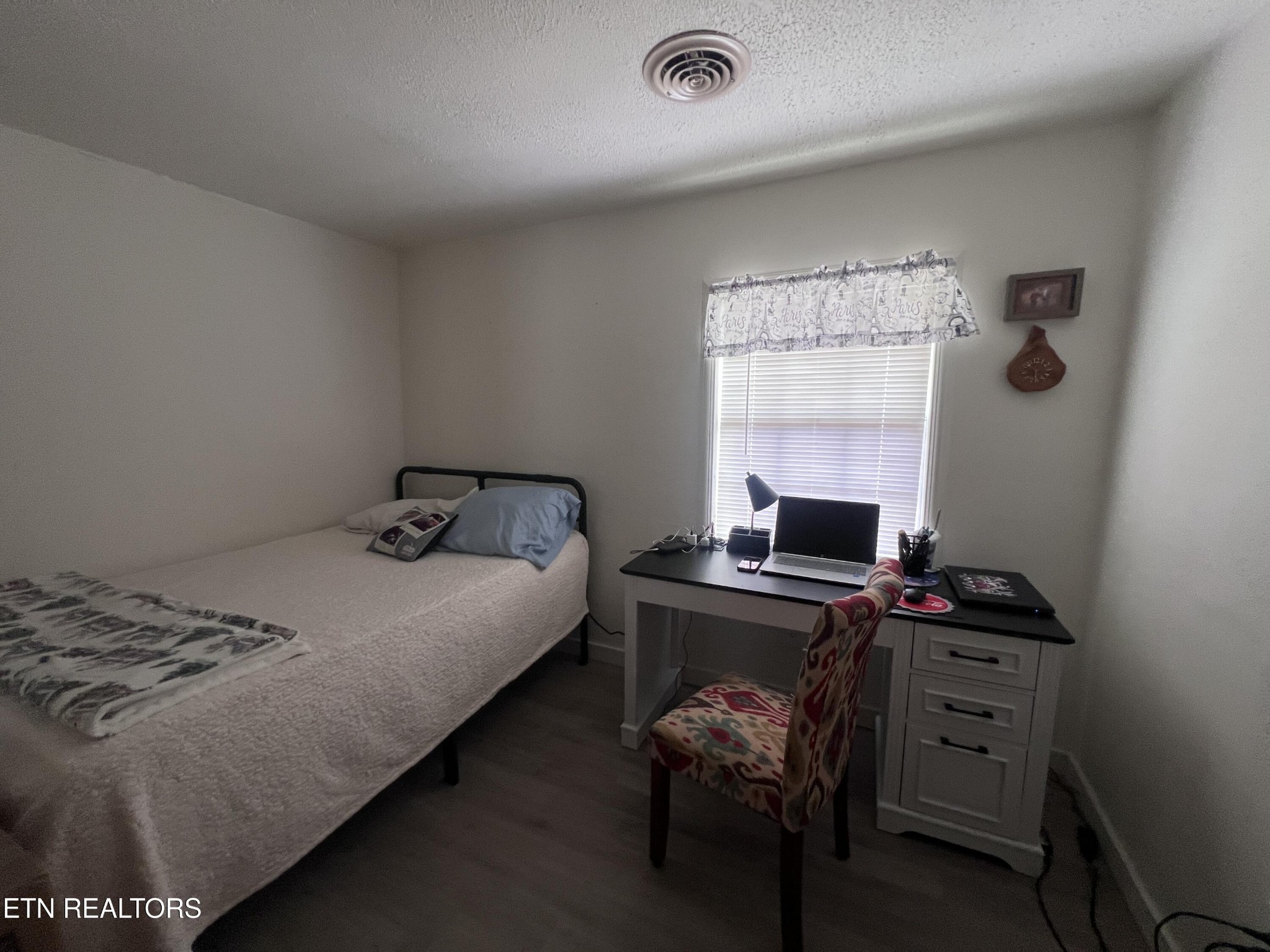 428 Patton Heights Circle Jamestown, TN 38556 - Photo 17 of 29 a bedroom with a bed and a desk