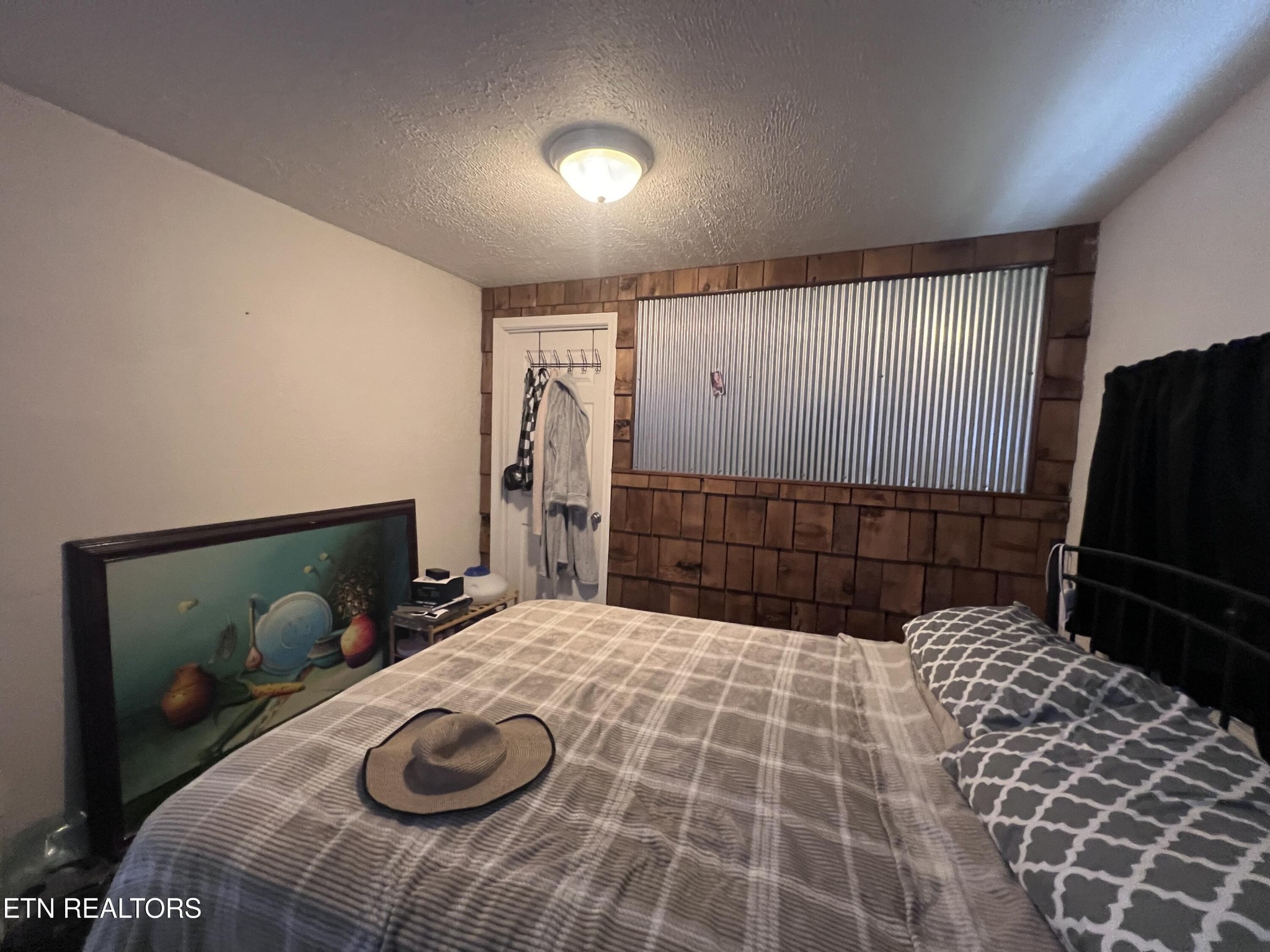 428 Patton Heights Circle Jamestown, TN 38556 - Photo 22 of 29 a bedroom with a bed and a mirror