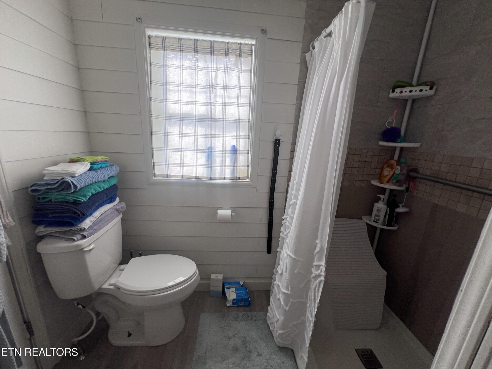 428 Patton Heights Circle Jamestown, TN 38556 - Photo 24 of 29 a white toilet sitting next to a bathroom sink and a tub