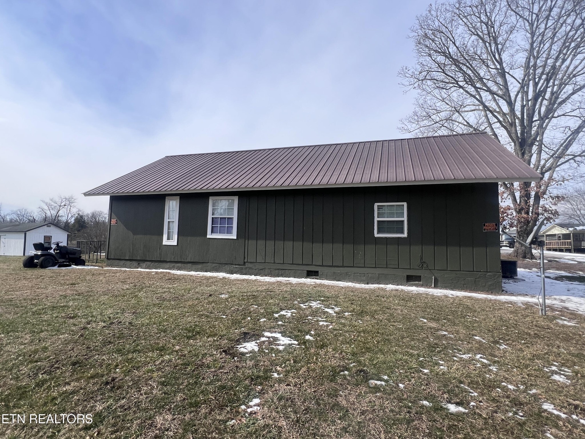 428 Patton Heights Circle Jamestown, TN 38556 - Photo 3 of 29 a front view of a house with a yard and garage