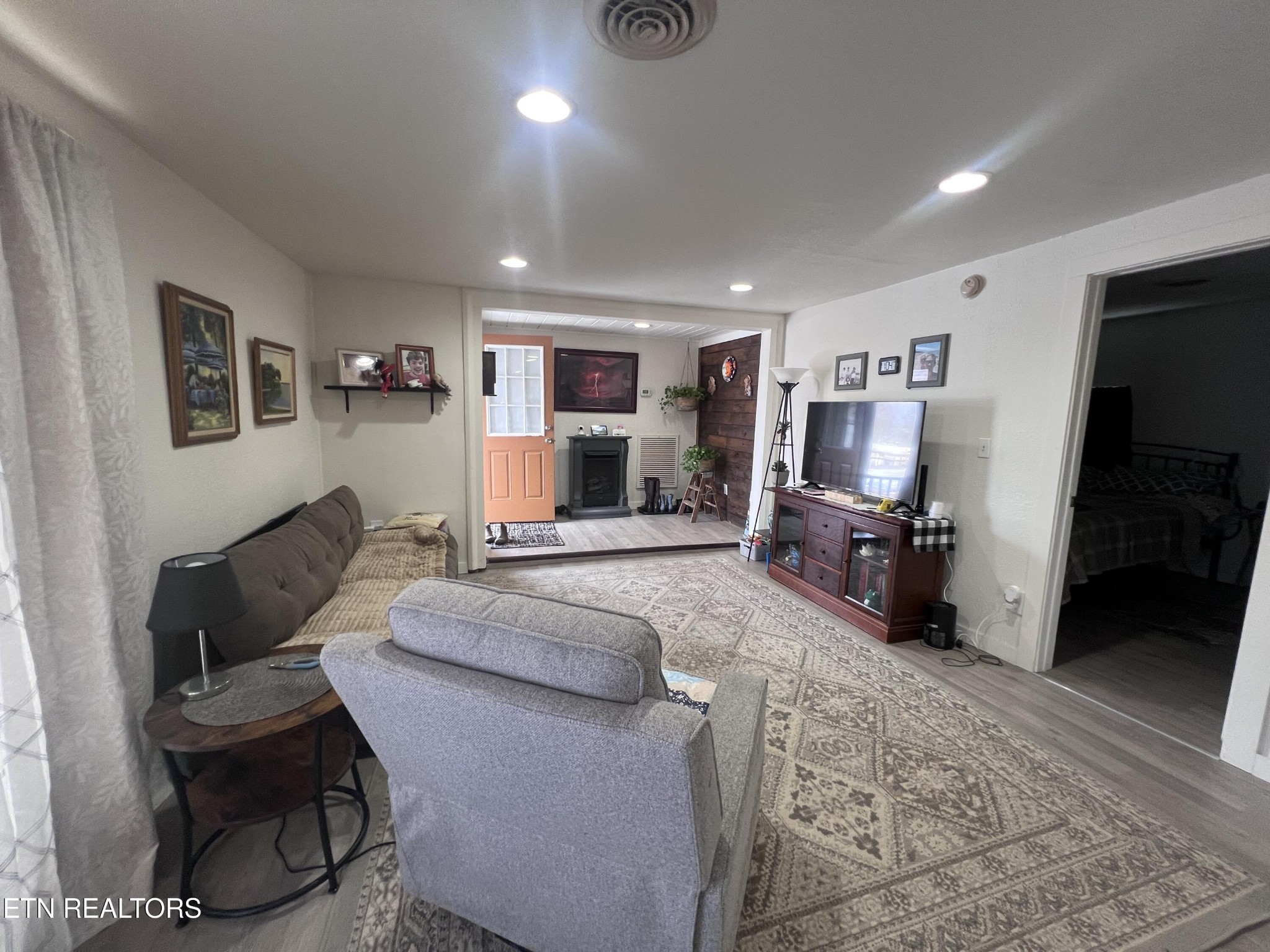 428 Patton Heights Circle Jamestown, TN 38556 - Photo 9 of 29 a living room with furniture and a flat screen tv