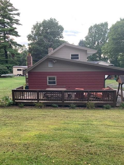 263 Hemlock Springs Road Armagh, PA 15920 - Photo 17 of 25 a view of a house with a swimming pool and a yard
