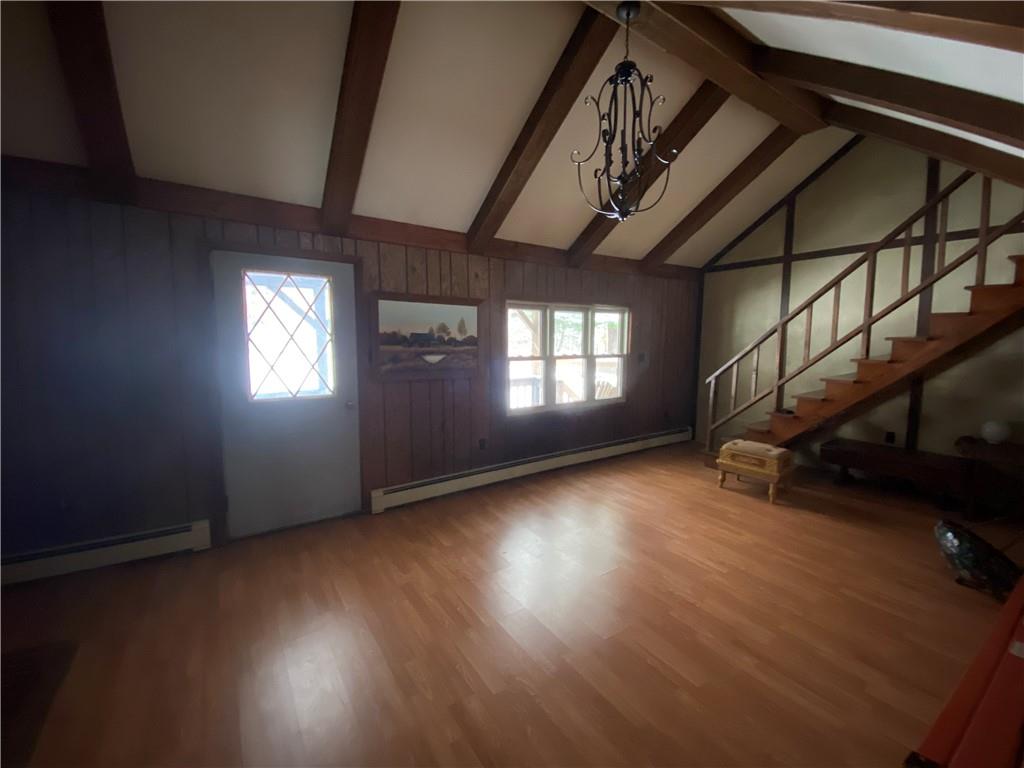 263 Hemlock Springs Road Armagh, PA 15920 - Photo 5 of 25 a view of an empty room with wooden floor and windows