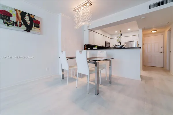 a view of kitchen with furniture and wooden floor