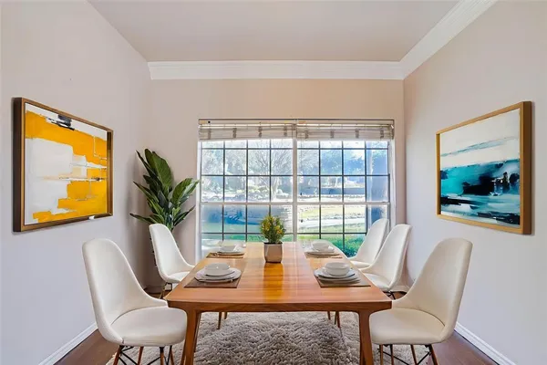 a view of a dining room with furniture window and outside view