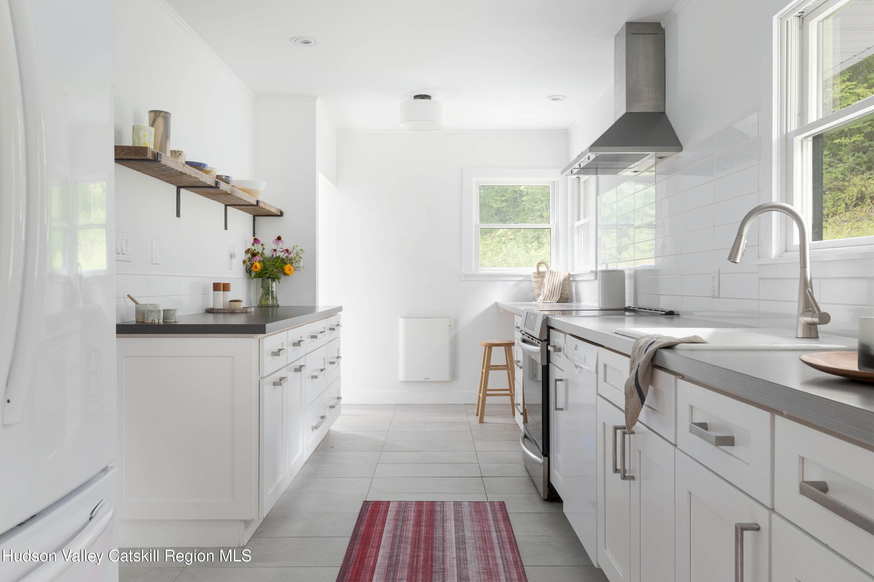 292 County Rte 27B Hudson, NY 12534 - Photo 15 of 40 a kitchen with cabinets a sink and appliances