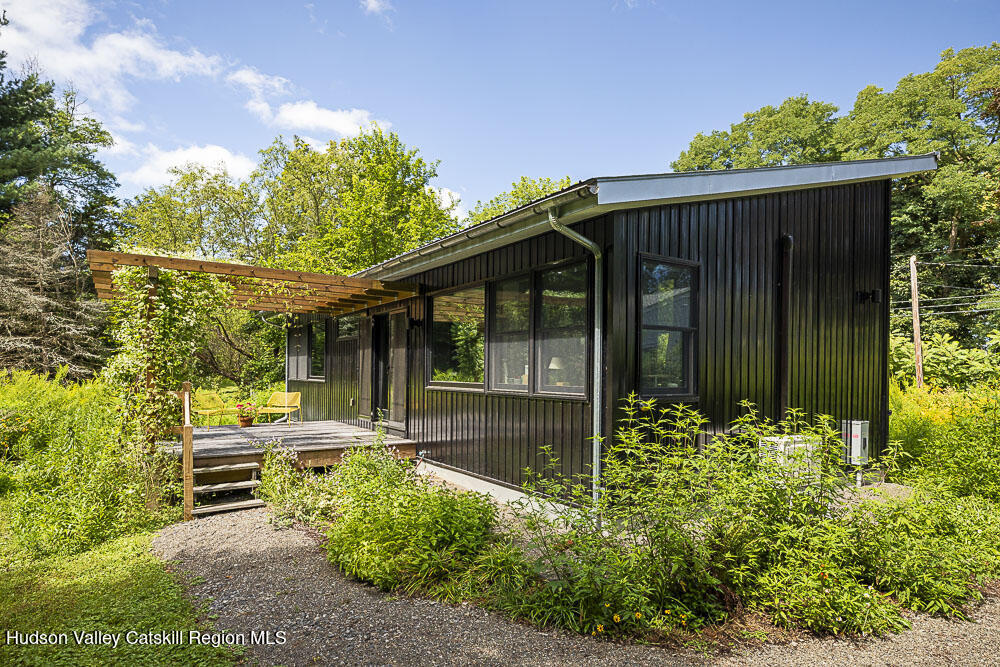 292 County Rte 27B Hudson, NY 12534 - Photo 25 of 40 a backyard of a house with yard and outdoor seating