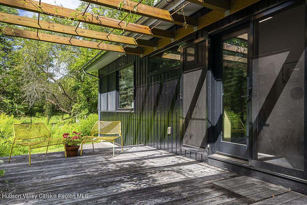 292 County Rte 27B Hudson, NY 12534 - Photo 28 of 40 a view of a house with a patio