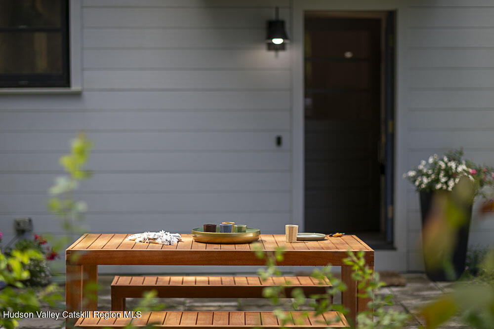 292 County Rte 27B Hudson, NY 12534 - Photo 3 of 40 a terrace with a table and chairs