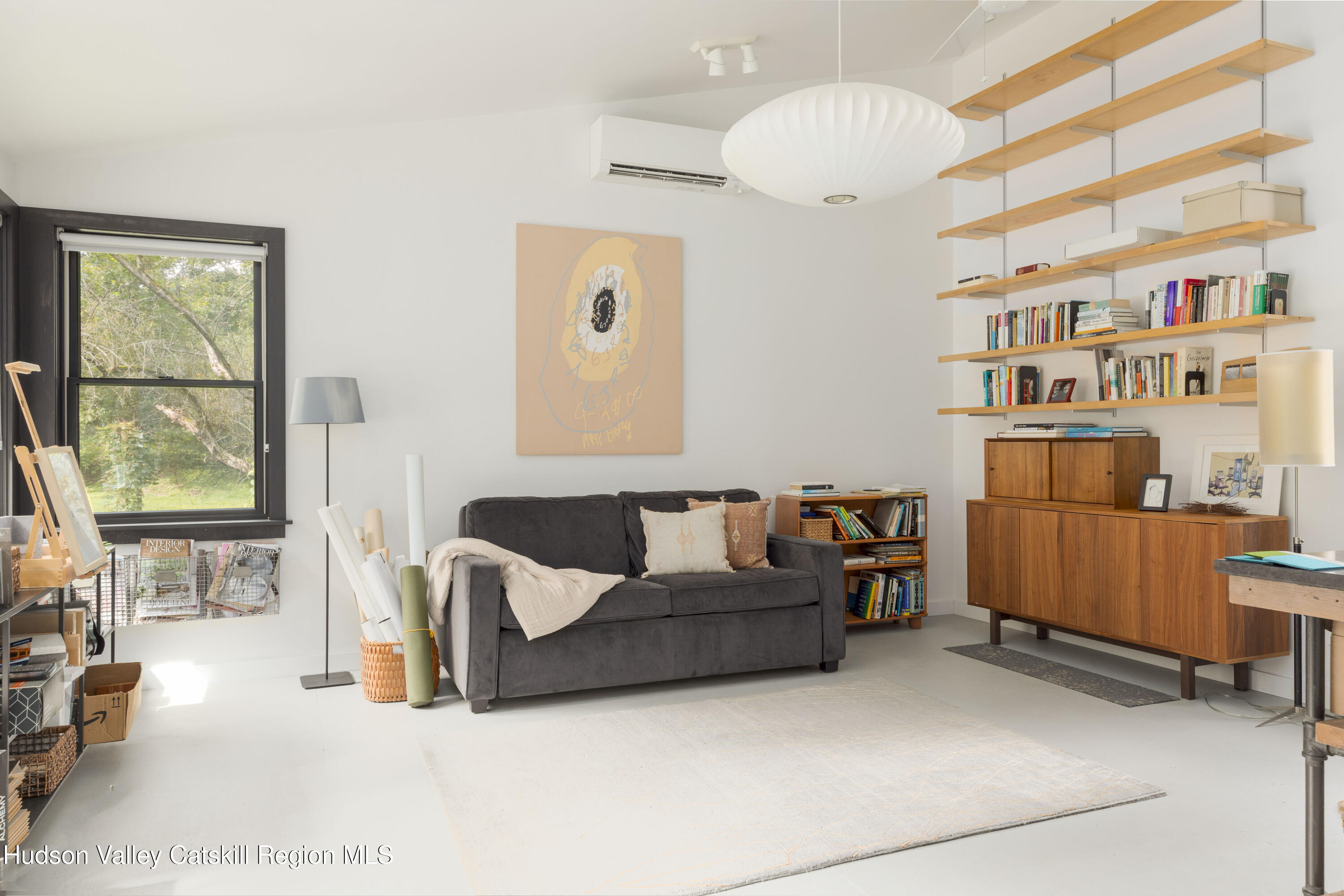 292 County Rte 27B Hudson, NY 12534 - Photo 31 of 40 a living room with furniture a flat screen tv and a window