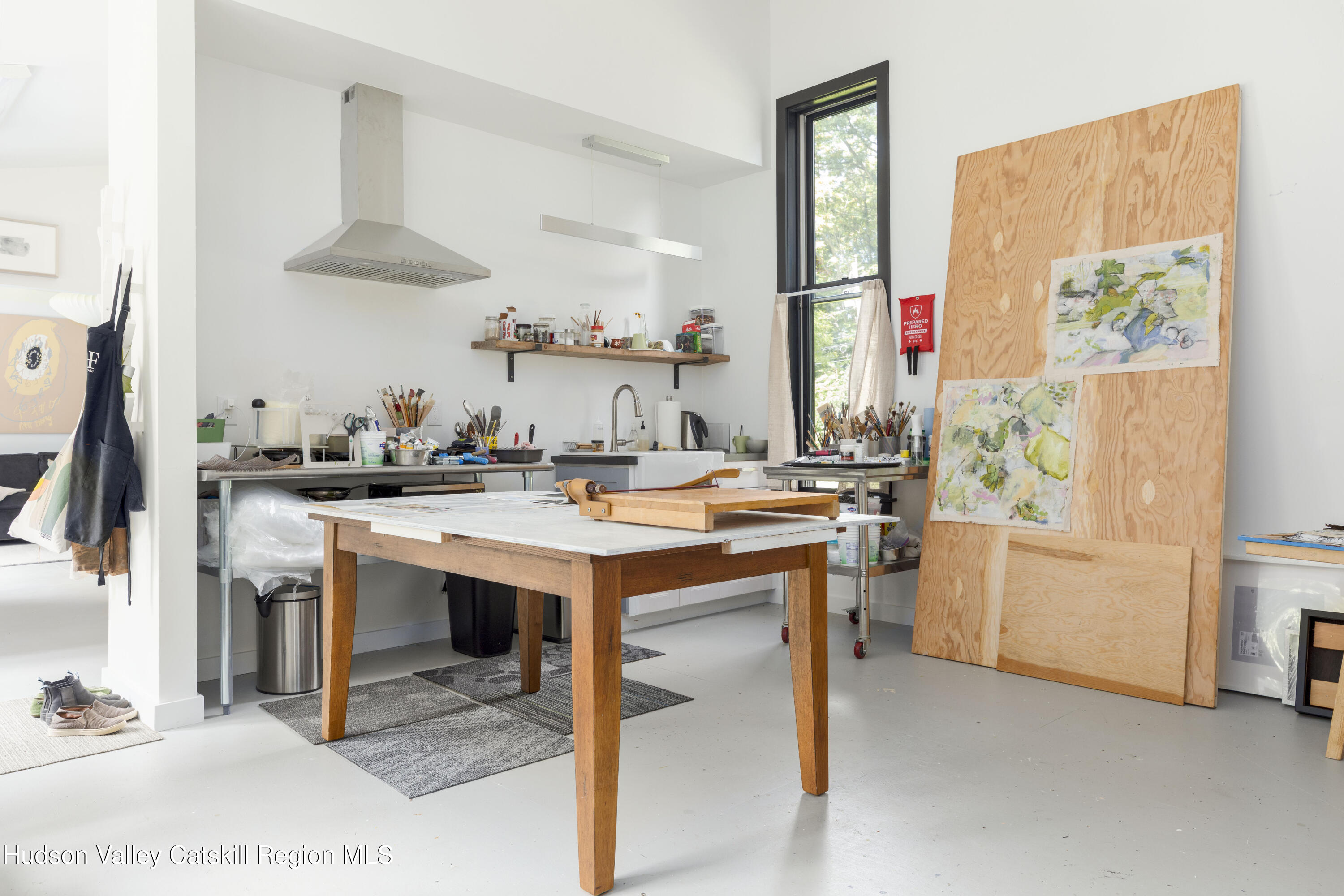 292 County Rte 27B Hudson, NY 12534 - Photo 34 of 40 a room with a table chairs and a kitchen view