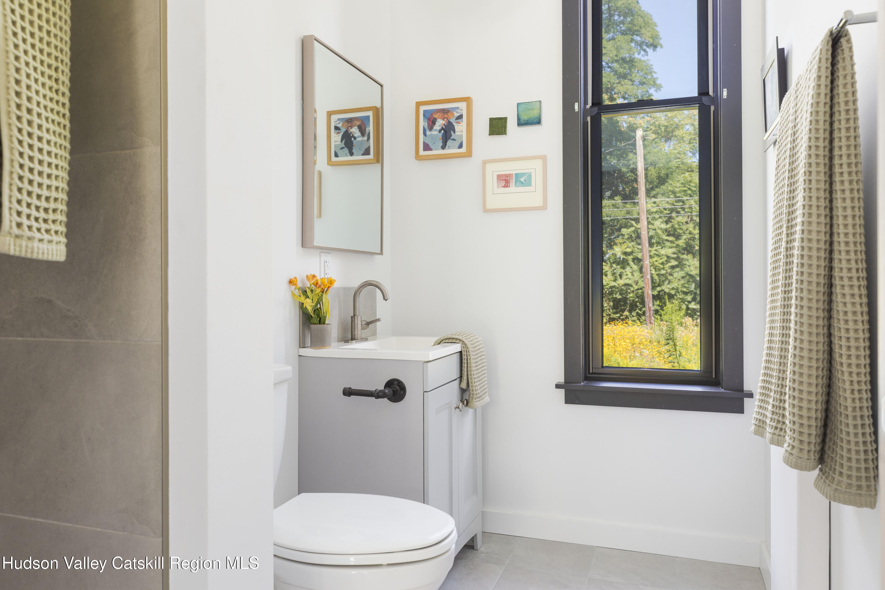 292 County Rte 27B Hudson, NY 12534 - Photo 36 of 40 a white toilet sitting next to a bathroom sink