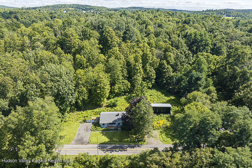 292 County Rte 27B Hudson, NY 12534 - Photo 39 of 40 a view of a house with a yard and sitting area