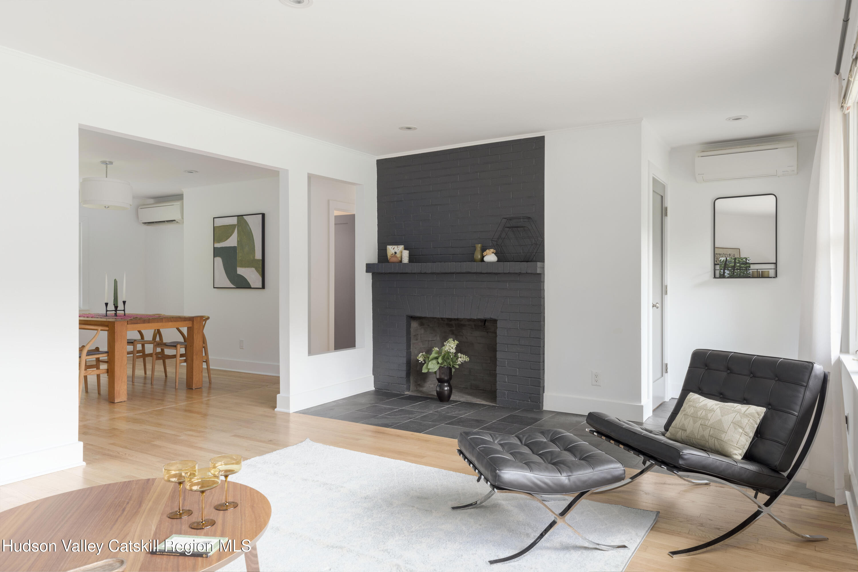 292 County Rte 27B Hudson, NY 12534 - Photo 10 of 40 a living room with furniture and a fireplace