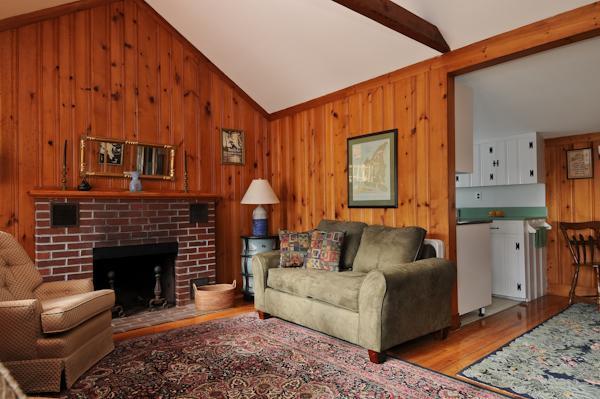 20 Piney Road Cotuit, MA 02635 - Photo 3 of 9 a living room with furniture and a fireplace