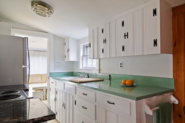 20 Piney Road Cotuit, MA 02635 - Photo 5 of 9 a kitchen with stainless steel appliances granite countertop a sink stove and cabinets