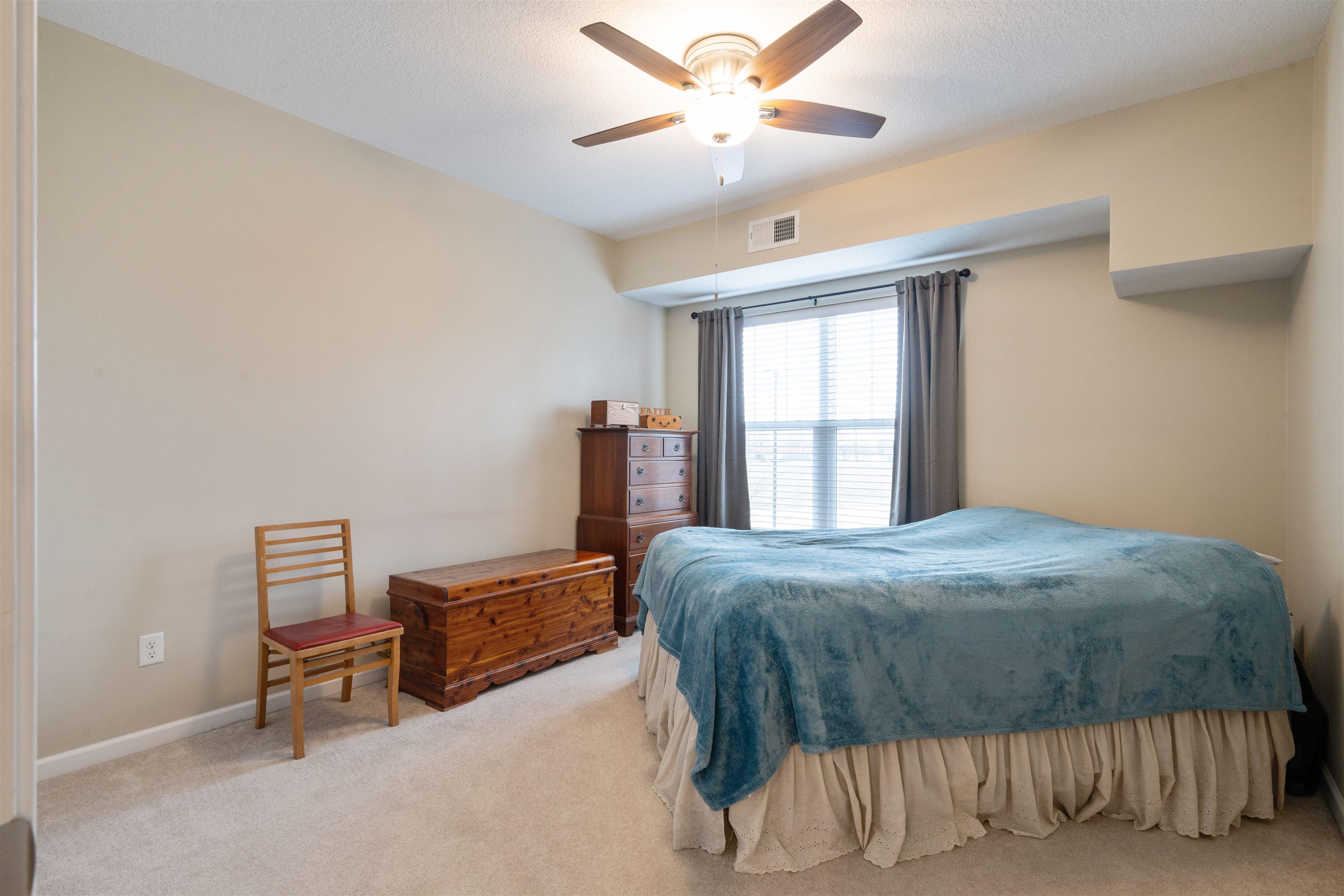 2592 Middle Road, Unit 208 Bettendorf, IA 52722 - Photo 12 of 19 a bedroom with a bed and window