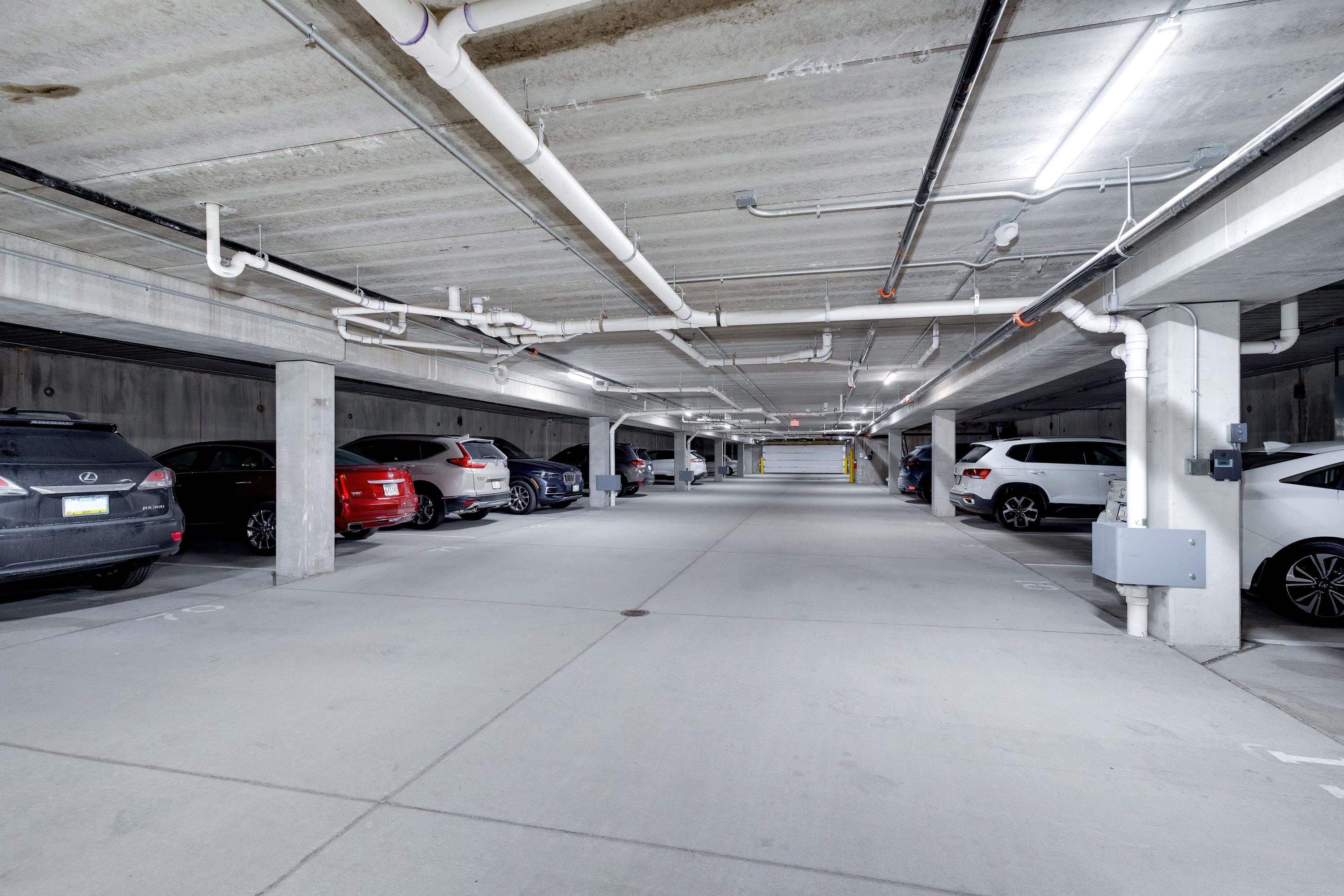 2592 Middle Road, Unit 208 Bettendorf, IA 52722 - Photo 18 of 19 a view of parking garage with cars