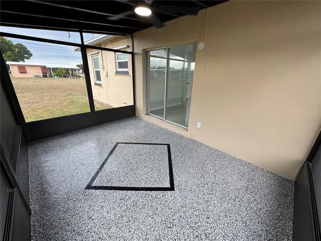 a view of a room with a large window