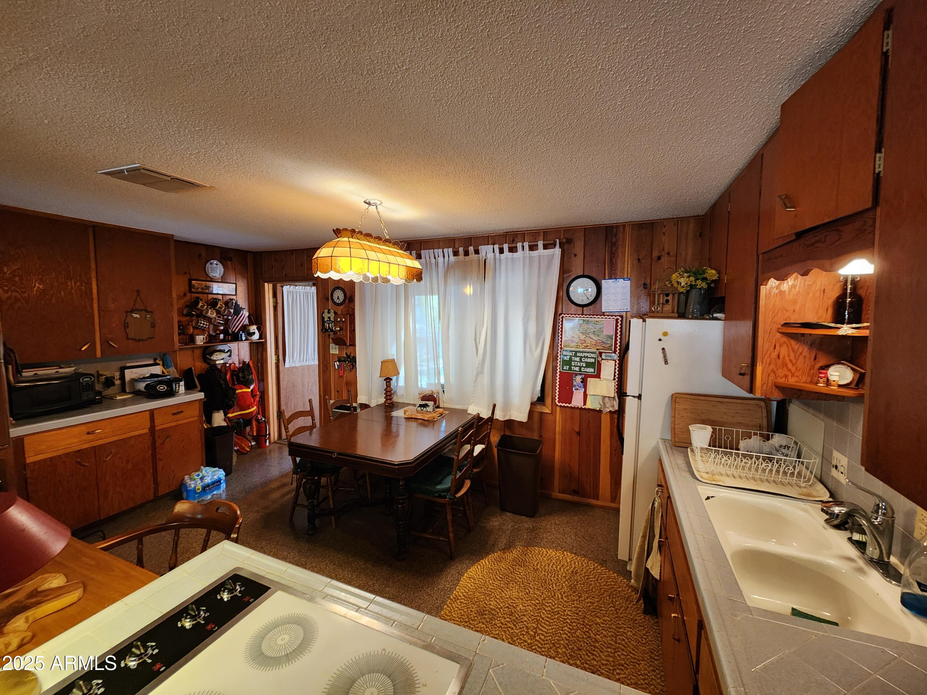 247 West Diamond Road Payson, AZ 85541 - Photo 27 of 42 a kitchen with sink stove and refrigerator