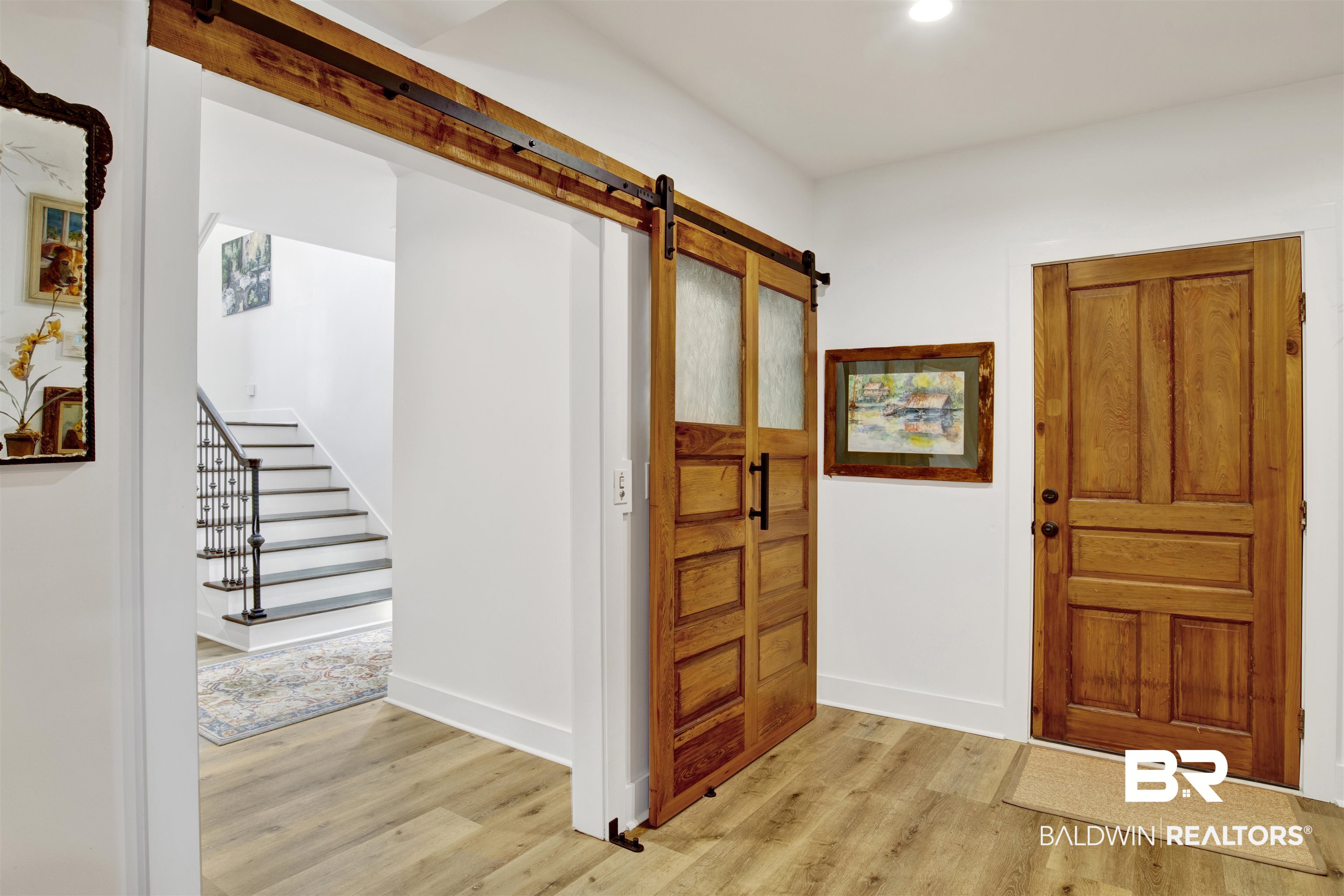 30538 River Road Orange Beach, AL 36561 - Photo 42 of 78 Foyer entrance with light wood-style floors, a barn door, stairway, and recessed lighting
